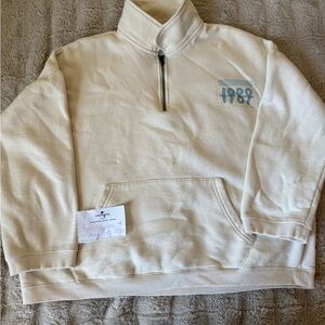 We found Wonderland 1989 TV White Half-Zip Sweater